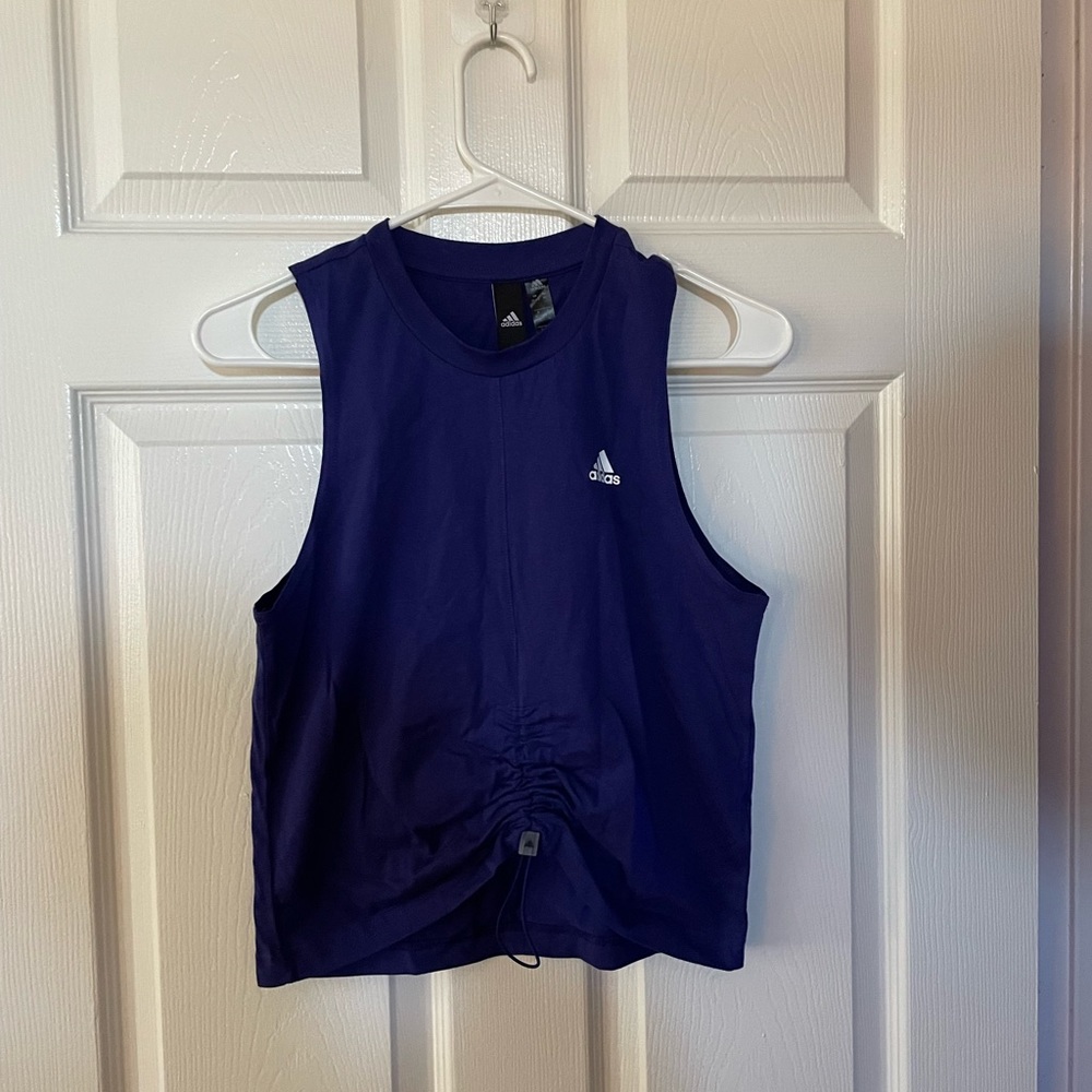 Adidas: purple tank, adjustable front scrunch, adidas logo on the left chest, XS